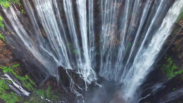 Amazing aerial view Tumpak Sewu waterfall in the morning on Java island, Indonesia.
