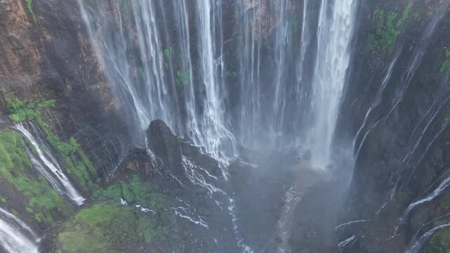 Amazing aerial view Tumpak Sewu waterfall in the morning on Java island, Indonesia.
