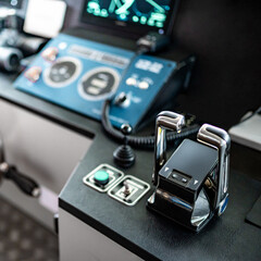 Throttle control on modern boat dashboard with navigation system and radar monitor screen in ship captain bridge or motorboat control room. Wheelhouse steering console. Nautical vessel technology © zephyr_p