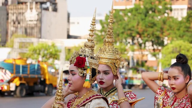 Thai Traditional Dancers Adjusting Golden Chada Headdresses in Bangkok City