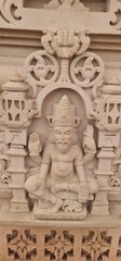 Obraz premium Intricate Traditional Indian Carvings and Religious Relief Designs on Sandstone wall at Heritage Corridor in Ujjain, Madhya Pradesh, India 