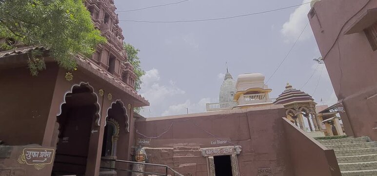 Traditional Red Shikhara Temple Top and Inner Courtyard Architecture of Bhartrihari Caves in Ujjain Madhya Pradesh