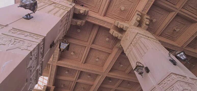 Low Angle View of Intricately Carved Sandstone Pillars and Grand Decorative Ceiling Architecture at Mahakal Corridor in Ujjain