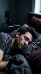Obraz premium Man Sleeping Peacefully In Dark Bedroom Restful Nighttime Slumber