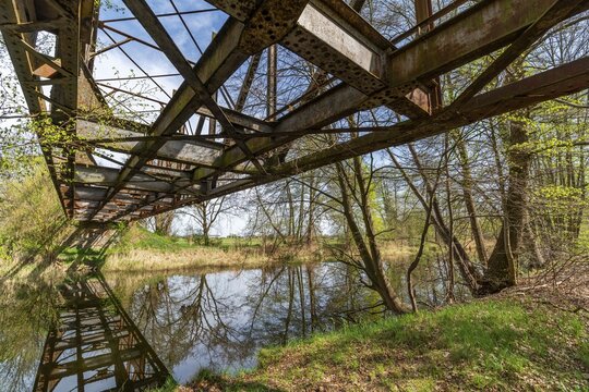Lost place, disused rusty railway bridge in the forest reflected in the Finow Canal, Liebenwalde, Oberhavel, Brandenburg, Germany