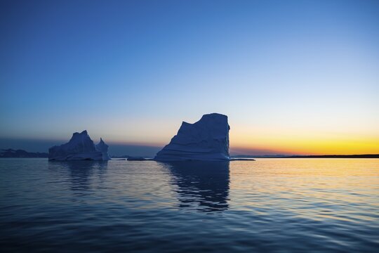 Icebergs at sunset, midnight sun, Scoresbysund, East Greenland, Greenland