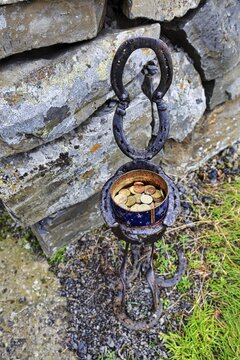 Tin with coins, donations for visiting a church, decorative stand, Vidimyrarkirkja peat church, Vidimyri, near Varmahlid, Skagafj&ouml;r&eth;ur, Iceland