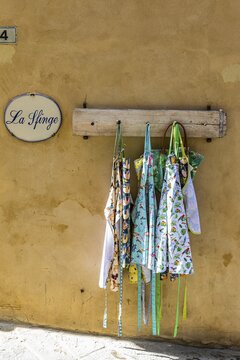 Aprons hung on hooks as decoration, Montalcino, Tuscany, Italy