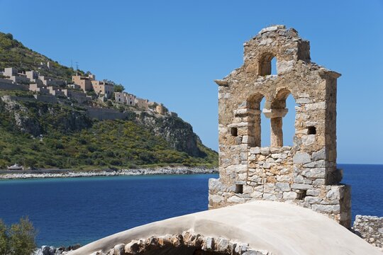 A historic ruined church structure overlooking the sea under a blue sky, Limeni, Areopoli, Laconia, Peloponnese, Greece