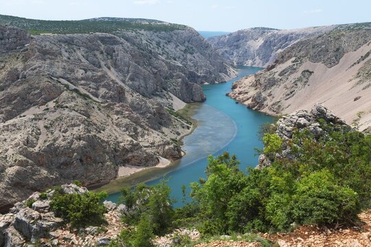 The river meanders through a stony gorge with turquoise blue water, surrounded by green trees, Pariževacka Glavica, Parizevacka, location of Karl May films, Zrmanja River, Jasenice, Zadar County, Croatia
