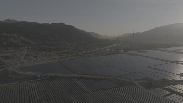Aerial view of wind turbines and solar farms near the Cam Lam&ndash;Vinh Hao Expressway in Thuan Bac Commune, Khanh Hoa, Vietnam, showcasing large-scale renewable energy infrastructure.