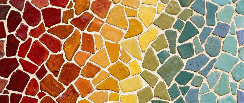 Colorful mosaic tile pattern with gradient from red to blue, artistic abstract texture, handmade tile design, decorative background, modern wall or floor concept.