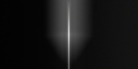 Abstract motion blur captured with vertical white light streak on dark background showing minimalist artistic light effect. © sd