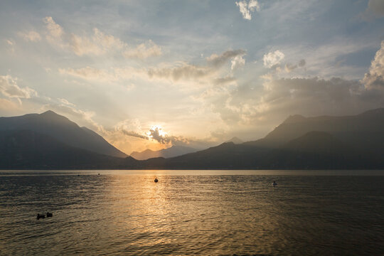 Sunset over Lake Como with mountains silhouette
