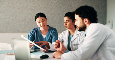 Obraz premium Hospital, team and doctors in meeting with documents for surgery schedule, treatment plan and advice. Healthcare, clinic and people with patient report for consulting, medical service and discussion