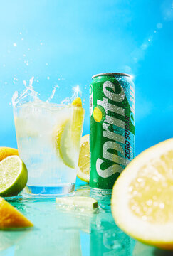 Refreshing Cold Sprite Zero Sugar Soda with Splashing Ice Glass and Fresh Citrus Fruits on a blue background, Warsaw, Poland, May 25, 2026