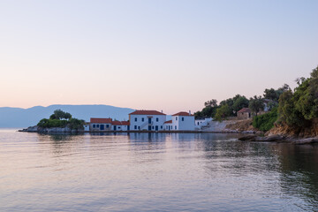 Obraz premium Beautiful gulf with pretty houses in Tzasteni bay, south west Pelion, Greece, in the dusk