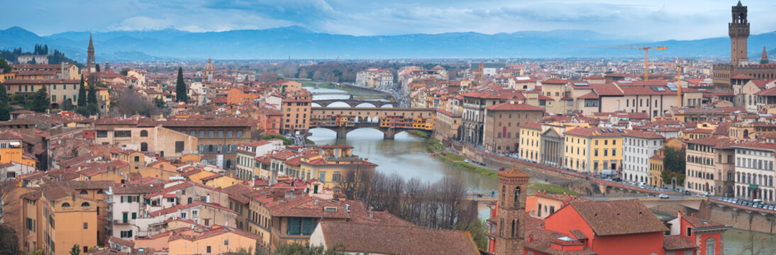  Panorama of Florence featuring Ponte Vecchio bridge and Arno river capturing historic Italy with copy space