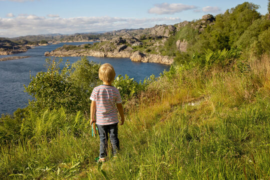 Happy people, enjoying amazing views in South Norway coastline, fjords, lakes, beautiful nature