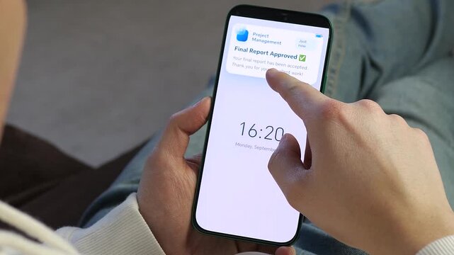 Receiving a Final Report Approved notification on a smartphone. The lock screen displays a message acknowledging excellent work. Perfect for productivity apps, corporate communication, and remote work