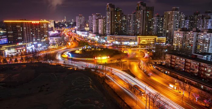 Night City Skyline with Illuminated Roundabout and Traffic Trails in China