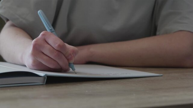 Close up of businessman hand keeping records and filling business documentation
