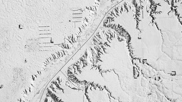 View from above on winter road in white snow land. Camera is zooming in, rotating counterclockwise. Animation based on image by NASA