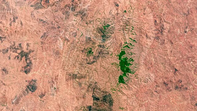 Panoramic shot on gully forms and erosion in arid areas. Camera is zooming in, rotating counterclockwise. Animation based on image by NASA