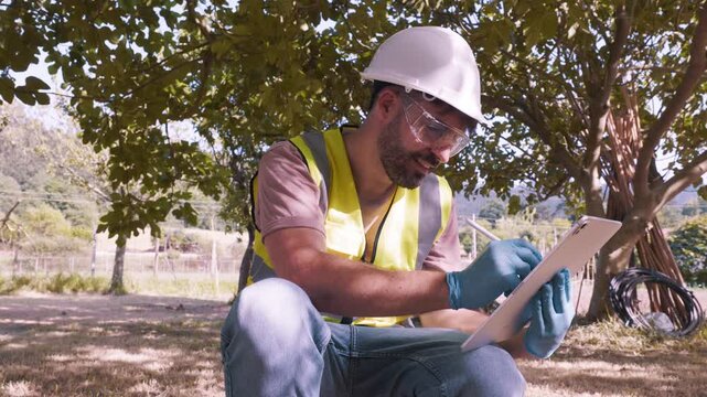 Environmental engineer analyzing pollution data on tablet