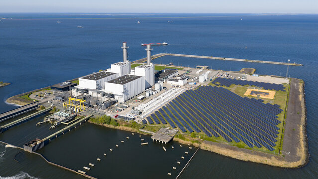 Aerial drone view of battery park at a power plant in Lelystad, showing electricity storage, grid balancing and energy infrastructure.
