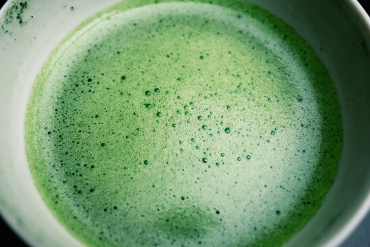 Freshly whisked frothy green matcha tea