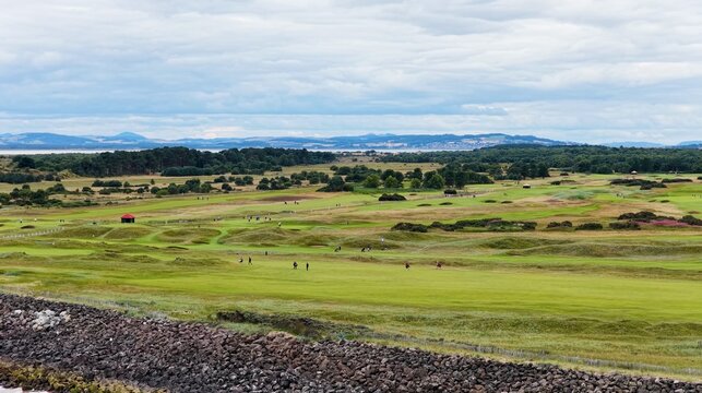 Aerial View of Golfers Walking on Carnoustie Links Under Overcast Sky