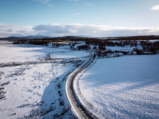 Fototapeta premium Aerial winter view of fields near Castle Roy, Nethy Bridge, Scotland