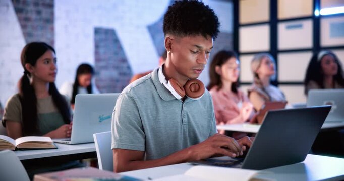 Man, laptop and typing in classroom at university for notes, review and development with education. Girl, computer and students with attention for learning, scholarship and assessment at college