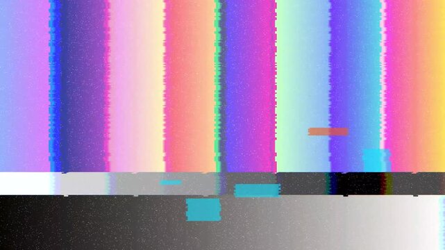Colorful vertical bars and grayscale gradient indicate a broadcast signal error or television calibration screen with digital interference on a screen