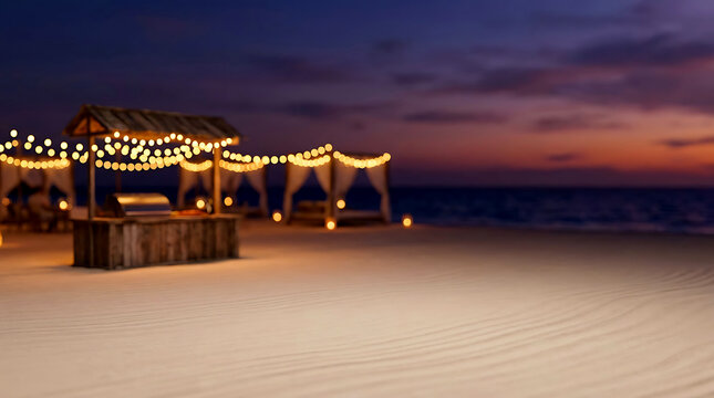 Beach party setup with string lights at sunset