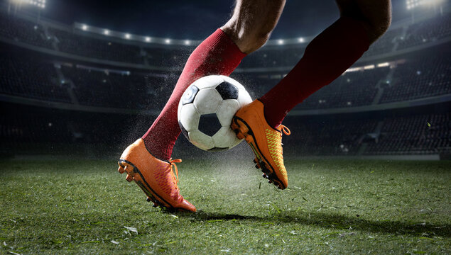Soccer cleats pressing ball with dirt spray on stadium grass. Concept of soccer training, match action, sports advertising, tournament promo, club marketing, coaching content, and stadium visuals.