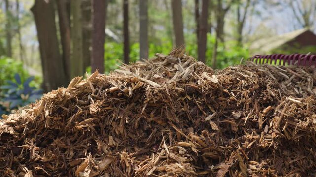 A large Pile of Mulch sitting in the Spring Sun after delivery.
