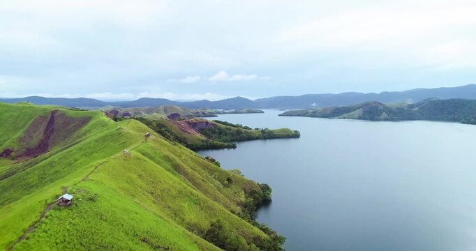 Aerial View of Sentani Lake and Green Hills in Papua Indonesia