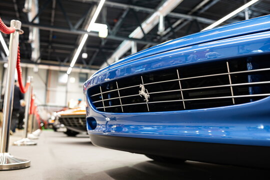 Lucerne, Switzerland, May 30, 2026. A low-angle close-up of the chrome prancing horse in the grille of a blue Ferrari 456