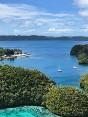 Aerial View of Tropical Harbor with Sailboats and Limestone Karst Islands © blueringmedia