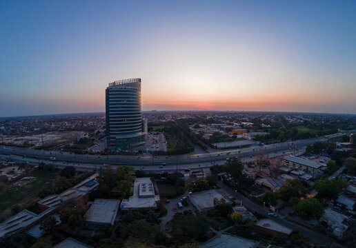 Aerial view of the Arfa Kareem Tower and the urban skyline during sunset in Lahore, Punjab, Pakistan.