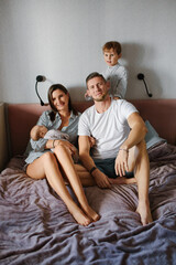 Obraz premium Happy Young Family With Two Children At Home