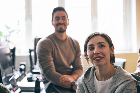 Smiling female business expert attending office meeting