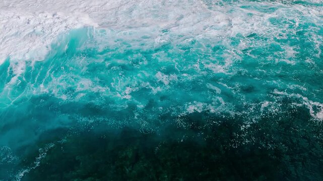 Abstract aerial texture of foamy sea surface with strong wave energy and motion. Aerial