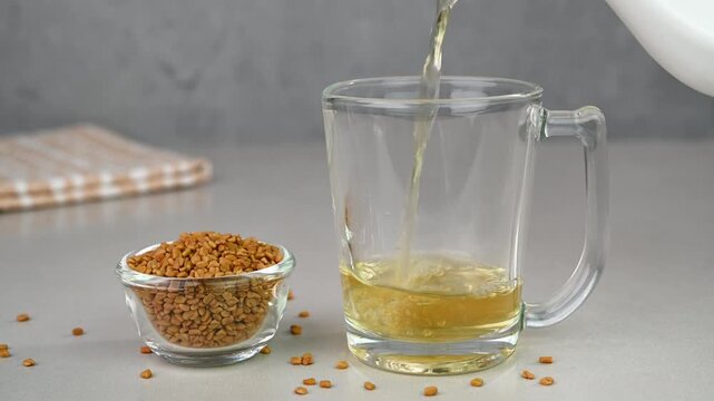 Fenugreek water in a glass cup.