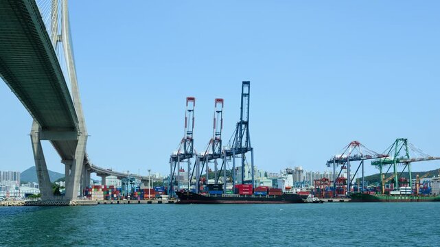 Cargo Ship Docking at Busan Port with Tugboat Assistance and Maritime Operations Timelapse