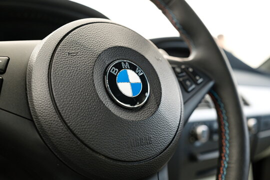 Lucerne, Switzerland, May 30, 2026. Leather-wrapped steering wheel with BMW logo inside a classic E60 M5 sedan.