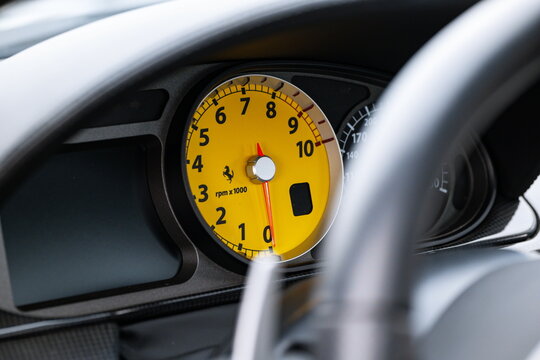 Lucerne, Switzerland, May 30, 2026. Yellow rev counter tachometer dial gauge through a Ferrari 599 steering wheel