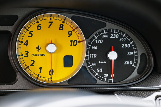 Lucerne, Switzerland, May 30, 2026. Yellow tachometer and 360 km/h speedometer gauge cluster inside a Ferrari 599